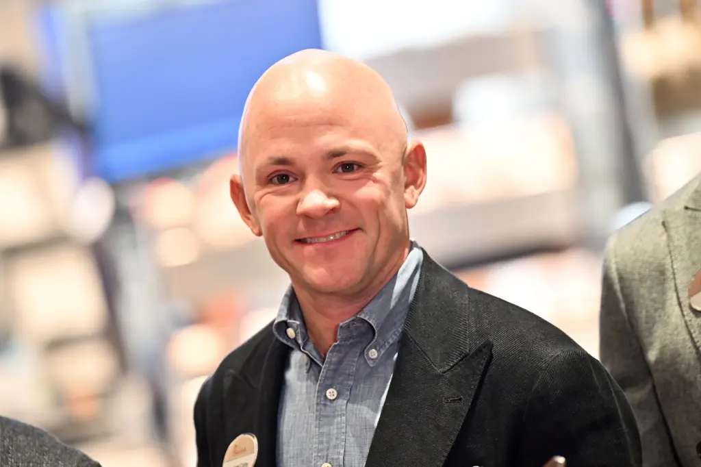 Chick-fil-A CEO Andrew Cathy smiling in a blazer